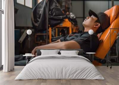 young asian worker in orange safety helmet sleeping on chair in warehouse. Generative AI Wall mural