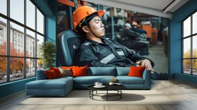 young asian worker in orange safety helmet sleeping on chair in warehouse. Generative AI Wall mural