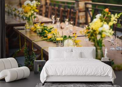 Table set up for a special event/wedding. Yellow and green fresh flowers Wall mural