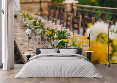 Table set up for a special event/wedding. Yellow and green fresh flowers Wall mural