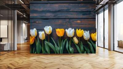 A line of yellow and white tulips set against a dark rustic wooden background, combining a sense of elegance and tranquility with a rustic touch. Wall mural