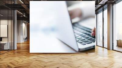 Business woman working on modern computer banner or panorama. Person buying online at internet. Laptop focused on keyboard detail with blur hand. copy space for text. Wall mural