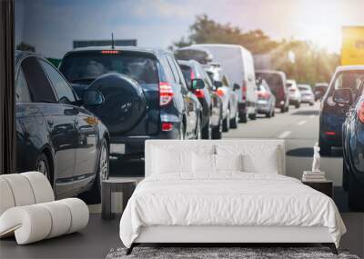 Car rush hours city street. Cars on highway in traffic jam Wall mural