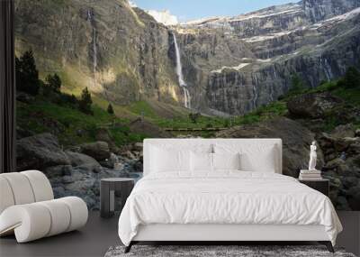 Cirque de Gavarnie beautiful waterfall with river underneath high cliffs, Pyrenees Mountains, France Wall mural