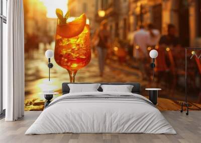 cocktail garnished with an orange slice glistens in the golden hues of the sunset, embodying relaxation and summer vibes. Wall mural