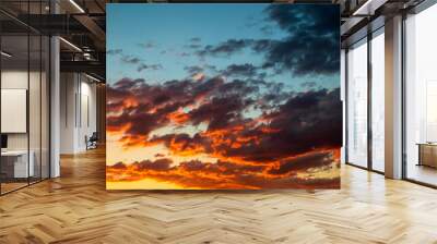 Dramatic orange sky clouds at sunset Wall mural