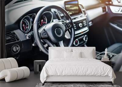 Interior view of car, Luxury car steering wheel and clean dashboard with display or monitor screen. Wall mural