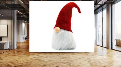 Gnome a Christmas elf wearing big red with glitters hat and standing on white background Wall mural