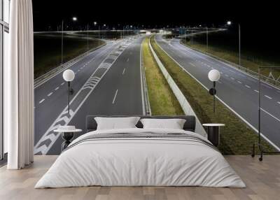 highway crossroad at night with modern street lights Wall mural