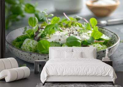 A delicate bowl of green salad with microgreens and creamy dressing, embodying freshness and health. Wall mural