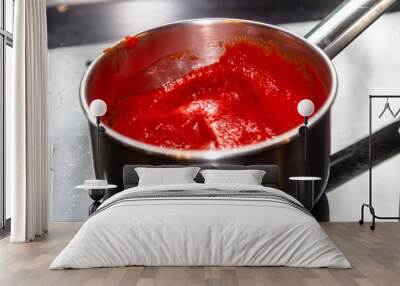 Cooking tomato sauce by chef hands, steps process on kitchen on black background copy text recipe Wall mural