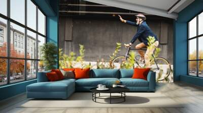 A Businessman Traveling To Work With A Bike Wall mural