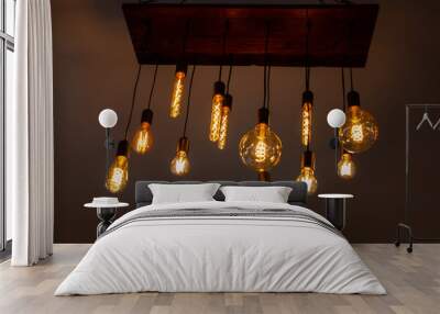 Old style bulb light hanging from ceiling, vintage indoor lamps Wall mural