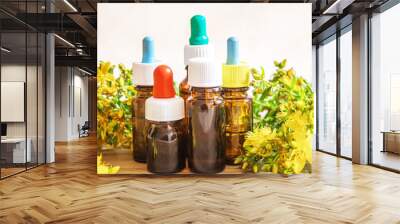 extract St. John's wort in a small jar. Selective focus. Wall mural