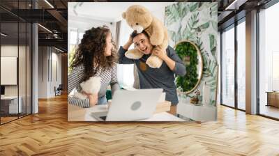 couple man and woman giving teddy bear as present happy joy and love Wall mural