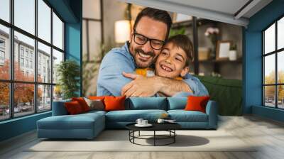 Dad hug son and share love with him spend time together at home Wall mural