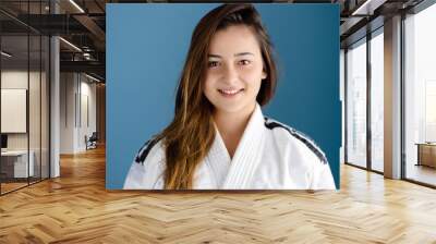 Portrait of a young woman in BJJ Judo Karate Gi Wall mural