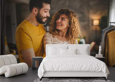 portrait of man and woman caucasian adult couple with book at home Wall mural