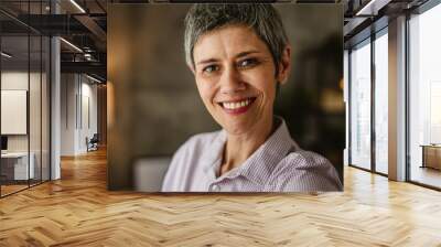 Self portrait of mature woman stand and smile at home Wall mural