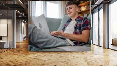 Young caucasian man teenager student study at home Wall mural