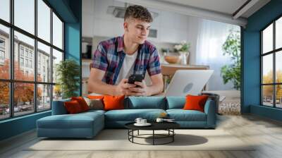 Young caucasian man teenager student study at home Wall mural