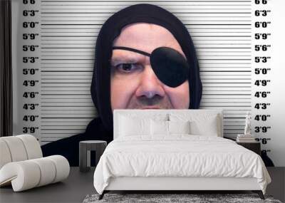 Portrait of a man with the eyepatch on background mugshot Wall mural