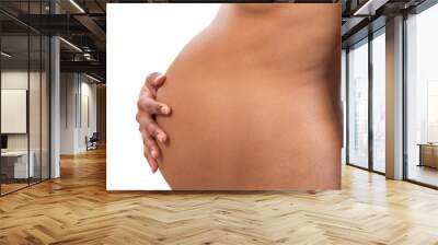 Pregnant woman belly on white background Wall mural