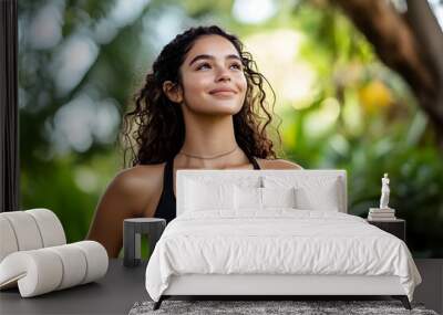 Confident Sporty Young Hispanic Woman Enjoying Nature and Wellness Wall mural