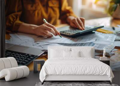 Female accountant working and calculating about finance document report on desk at home office Wall mural