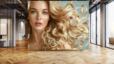 Fashionable blonde woman with long wavy hair on white background. Beautiful face close-up. Haircare, salon cosmetic and coiffure concept Wall mural