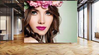 Beautiful Girl with Flowers. Face Closeup. Makeup and Hairstyle Wall mural