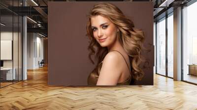 Beautiful glamorous model woman with long wavy and shiny hair against brown studio wall banner background Wall mural