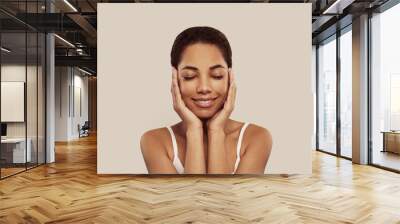 Close up shot of lovely African American woman with clear sooth skin portrait Wall mural