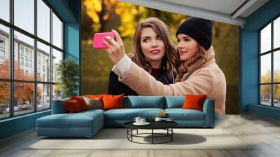 Cute Girls Models with Smartphone Taking Selfie Outdoors. Autumn Women Outdoor Wall mural