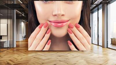 Female hand with manicured nails. Pink lips makeup and pink nailpolish, beauty manicure concept Wall mural