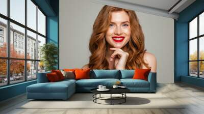 Happy red head woman smiling. Elegant redhead girl with curly hairstyle. Candid beauty Wall mural