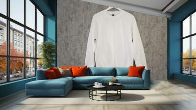 White sweatshirt blank mockup on a hanger on the grey background
 Wall mural