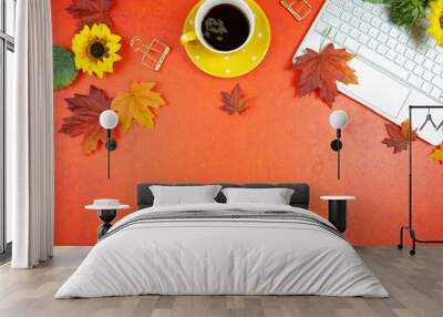 Autumn Fall Halloween Thanksgiving theme desktop workspace with laptop on stylish orange textured background. Top view blog hero header creative composition flat lay. Wall mural