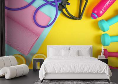 Health and fitness concept flatlay with exercise equipment on modern colorful background with copy space. Wall mural