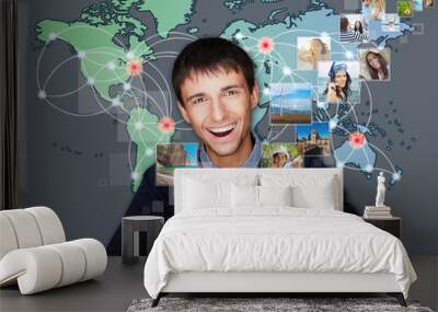 a technology man has images flying away from his modern tablet c Wall mural