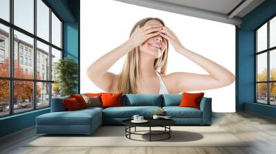 Woman hiding her eyes with hands and smiling isolated on white b Wall mural