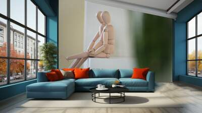 wooden people sitting at home and hugging. people relationship c Wall mural