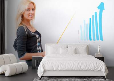 young business teacher showing growing profit with graph on whit Wall mural