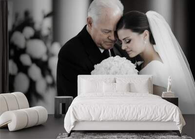 A bride, wearing a white gown, shares a tender embrace with an elderly man, likely her father, holding a bouquet of white roses. The setting is elegant and emotional. Wall mural