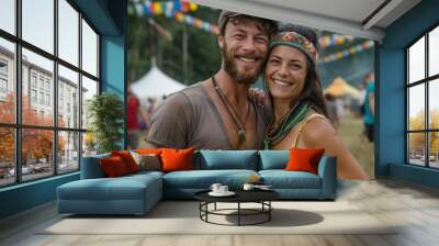 A smiling couple dressed in casual and comfortable attire enjoys an open-air festival. They exude happiness and warmth, surrounded by colorful decorations and crowds. Wall mural