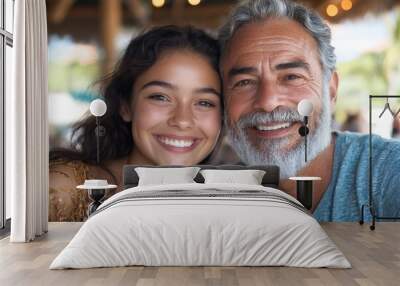 An elder with a white beard and a smiling young woman at a vibrant outdoor dining setup, illustrating cheerful familial connection and shared moments of happiness. Wall mural