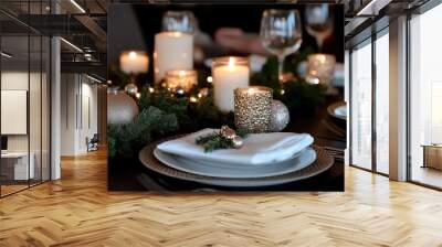 An elegant table setting featuring white candles, a sparkling golden garland, and lush green elements, perfect for an intimate holiday dinner atmosphere. Wall mural