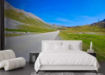 The high Albula Pass in the Swiss Alps with an empty road to the horizon Wall mural