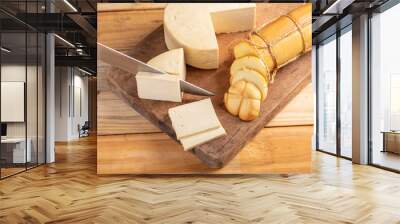 Cheese, details of beautiful and delicious cheese on rustic wooden surface, selective focus. Wall mural