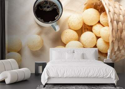 Cheese bread, breakfast table in Brazil, cheese bread, coffee and accessories, selective focus. Wall mural